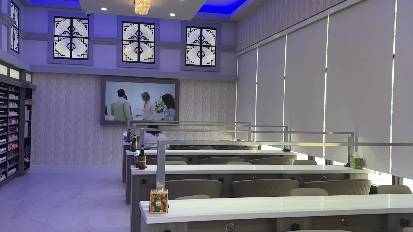 Manicure stations along the salon's main aisle