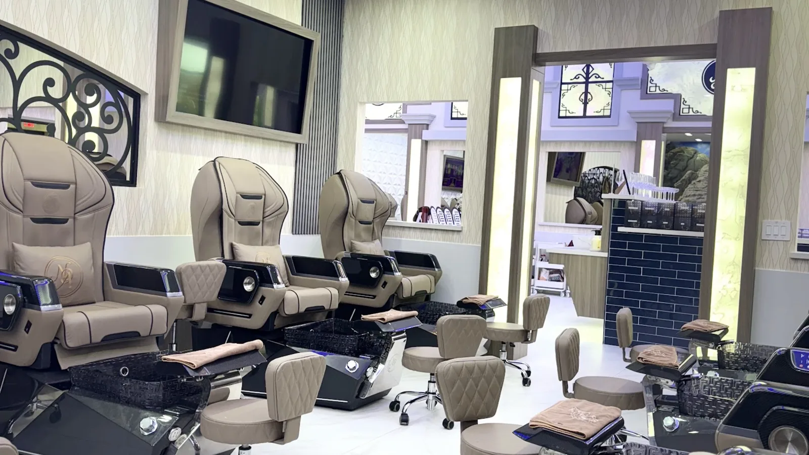 Rows of luxury massage pedicure chairs under ambient lighting