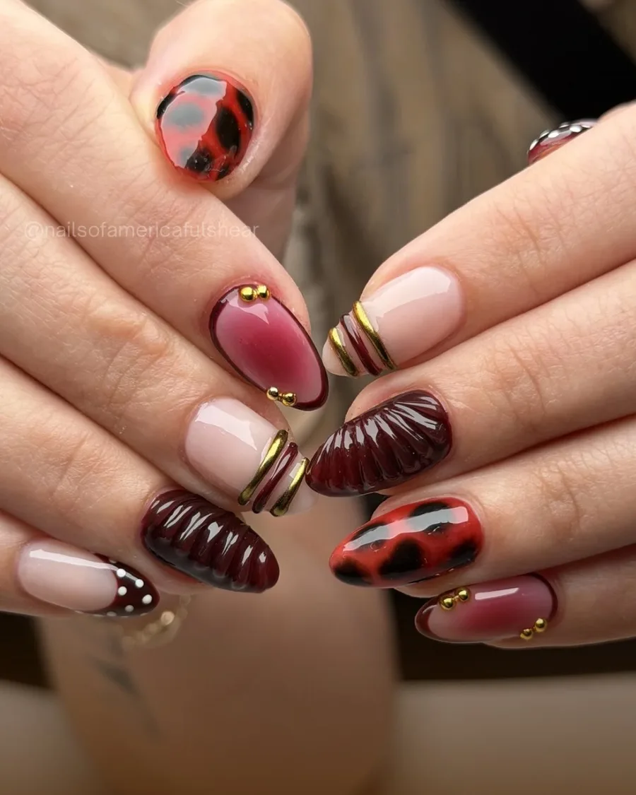 Burgundy and gold 3D nail art