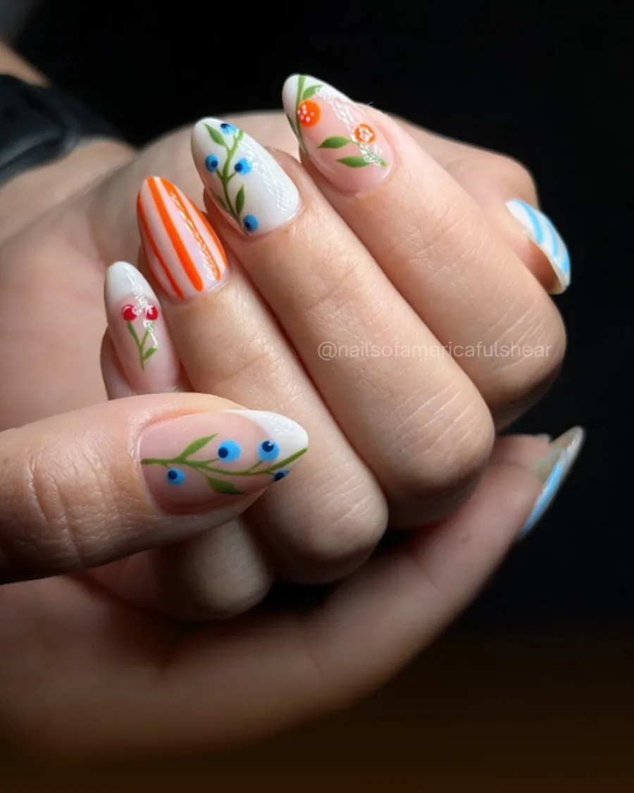 Hand-painted florals and stripes on natural-length nails